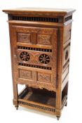 A late 19th century French carved oak cupboard,