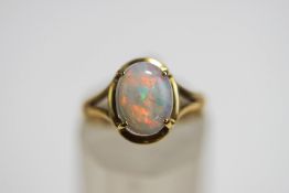 A single stone opal ring, stamped '9ct', finger size K, 2 g gross,