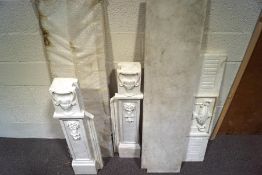 A marble fire surround with dentil cornice above an urn in rectangular frame,