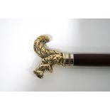 A walking stick with gilt metal squirrel knop