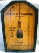 A carved wood and painted 'Moet and Chandon' hanging advertising sign,
