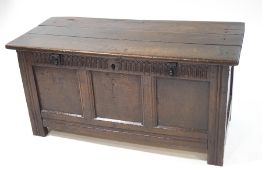 A 17th century oak coffer with triple panelled front,