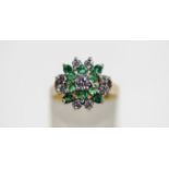 A 9 carat gold emerald and cubic zirconia cluster ring, finger size N, 3.
