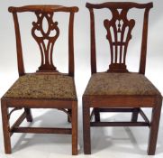 Two George III ash and elm side chairs, each with pierced splats,