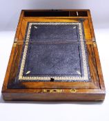 A 19th century rosewood and brass bound writing slope, black leather and tooled gilt slope,