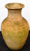 A large 'Ali Baba' style terracotta pot,