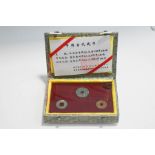 A Chinese presentation case of three square hole coins,
