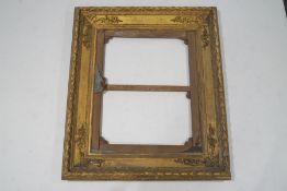 An exceptionally large 19th century giltwood and gesso picture frame,