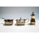 A matched three piece silver condiment set, Birmingham 1953 and 1955, with blue glass liners,