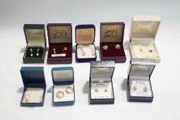 A collection of nine pairs of earrings, most stamped for 9 carat gold and most are stone set,