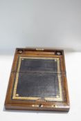 A Victorian mahogany and brass bound writing box, with black leather insert and two inkwells,