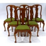 A set of six Queen Anne style beech dining chairs, with cabriole legs and padded drop in seats (NB.