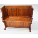 A varnished pine Church pew with eight panels to the back, 89.