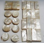 A large quantity of Chinese mother of pearl gaming counters, carved with figures (78 rectangular,