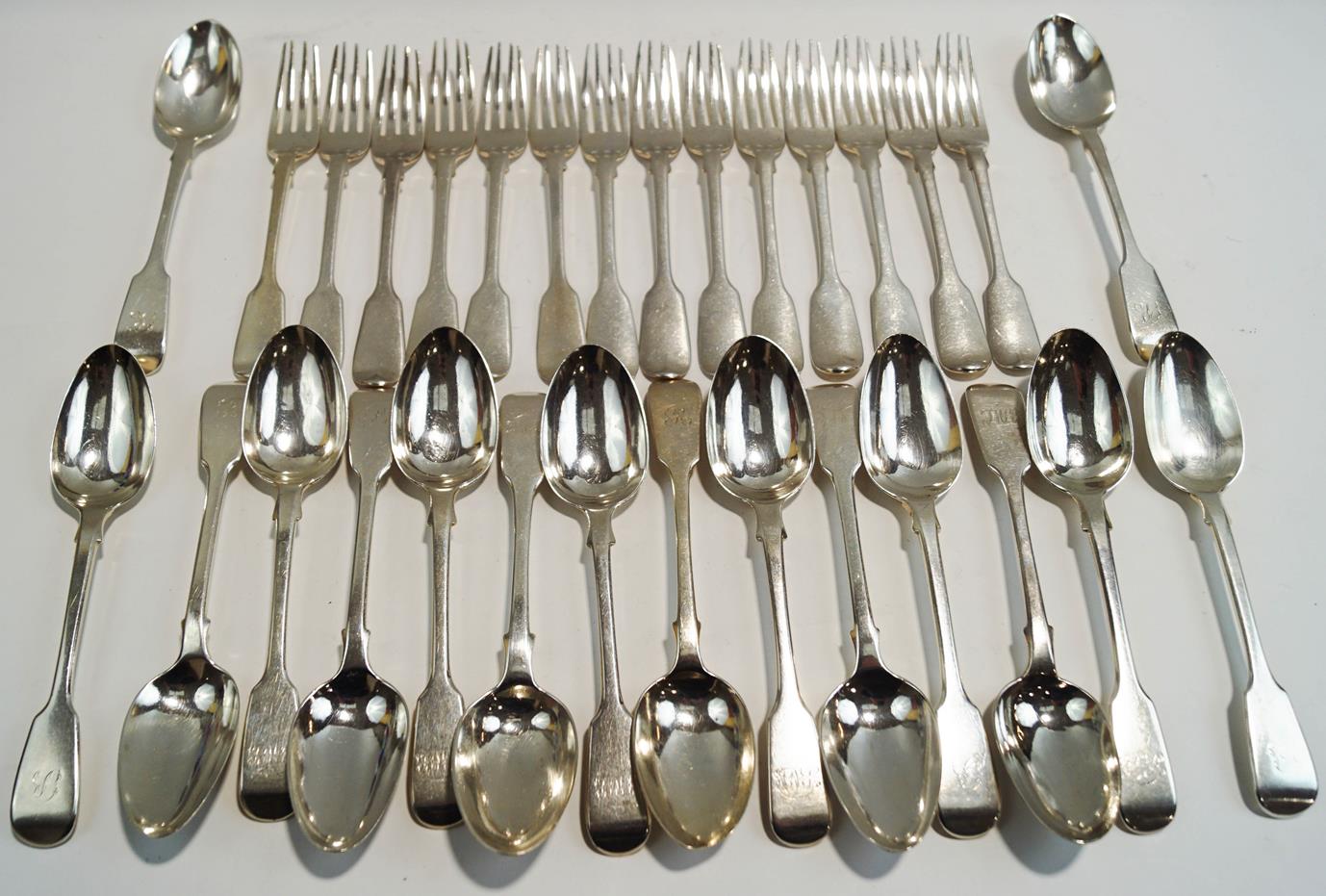 A set of seven Victorian silver fiddle pattern dessert spoons, by George Adams,