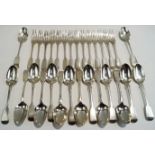 A set of seven Victorian silver fiddle pattern dessert spoons, by George Adams,