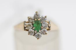 A 9 carat gold emerald and cubic zirconia cluster ring, finger size N1/2, 1.