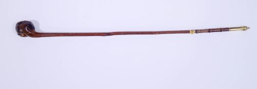 A carved wood Sunday walking stick