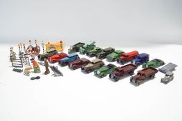 Various 1940s Dinky vehicles, a small quantity of model road signs,