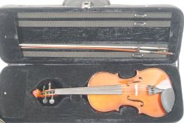 A late 20th century 3/4 violin in case with bow and accompanying bow