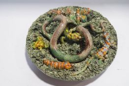 A Palissy style lizard, snake and insect dish, by Caldas Rainha Portuguese Pottery,