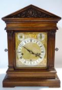 An architectural oak cased clock, Winterhalder and Hofmeier movement,