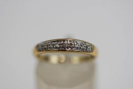 A 9 carat gold diamond half hoop ring, set with seven single cuts, finger size M1/2, 1.