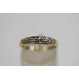 A 9 carat gold diamond half hoop ring, set with seven single cuts, finger size M1/2, 1.