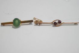 A two stone garnet bar brooch, stamped '9ct', 6.