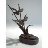 A 20th Century bronze of birds in flight, signed C.