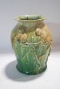 A 1930's Australian Remued pottery vase, moulded with koalas, incised factory marks to base,