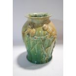 A 1930's Australian Remued pottery vase, moulded with koalas, incised factory marks to base,