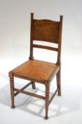An Arts and Crafts oak chair in the style of William Birch,