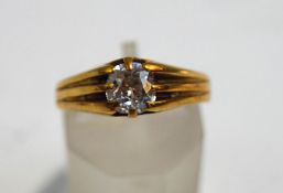 A Victorian 18 carat gold single stone diamond ring, London 1883,