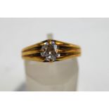 A Victorian 18 carat gold single stone diamond ring, London 1883,