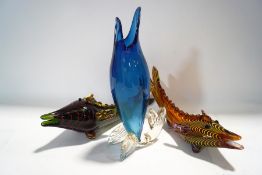 A collection of three Murano glass fish,