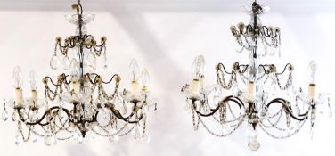 A pair of cut glass and moulded six branch chandeliers,
