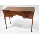 A Sheraton style mahogany sideboard of serpentine form with boxwood stringing,