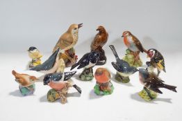 A collection of figures of birds, four Royal Worcester,