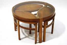 A 1960's Nathan teak coffee table with three fitted smaller tables,