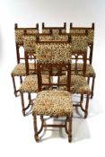 A set of six French walnut dining chairs with lionhead finials,