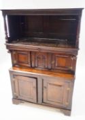 A 17th century and later oak court cupboard with top above two panelled doors,