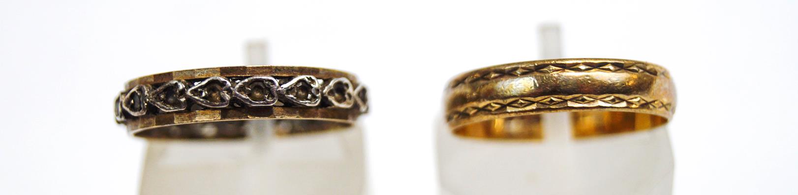 A 9 carat gold wedding ring; with a synthetic set eternity ring,