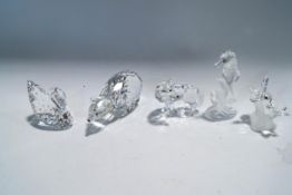 Five Swarovski Crystal ornaments: Wolf, Polar Bear, Seahorse, Bee with flower, Swan (missing stand),