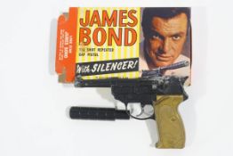 A mid 1960's 'Lone Star' James Bond 100 Shot repeater cap pistol,