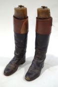 A pair of gentlemen's leather hunting boots and wooden trees