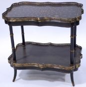 A Regency style two tier table, the shaped top with pierced brass gallery on faux bamboo legs,