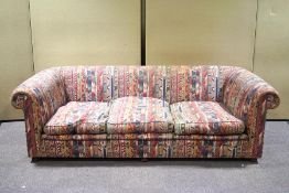 An exceptionally large modern sofa, upholstered in geometric Ikat style fabric,