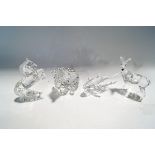 Four Swarovski Crystal animals: Grizzly Bear, Shark, Deer, Rearing Horse,