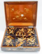 An early 20th century Japanese tortoiseshell and lacquered gaming counter box,